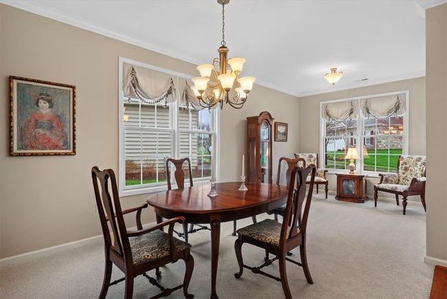 As you step inside this home you are greeted by a large combo dining and living area. This versatile space can be used as just a large dining room or separate full sitting area. | Image 23