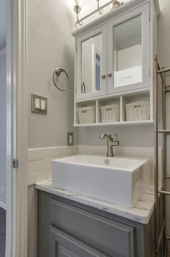 Bathroom with vanity and a textured wall | Image 27