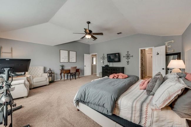 Bedroom featuring lofted ceiling, carpet flooring, and ceiling fan | Image 20