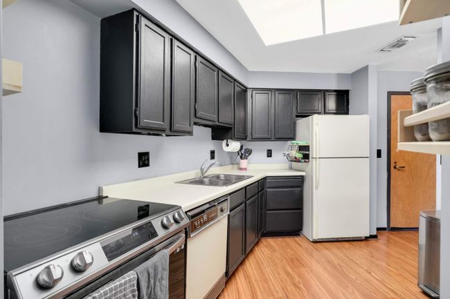 Cabinets fully refinished with a fresh, modern paint update | Image 18