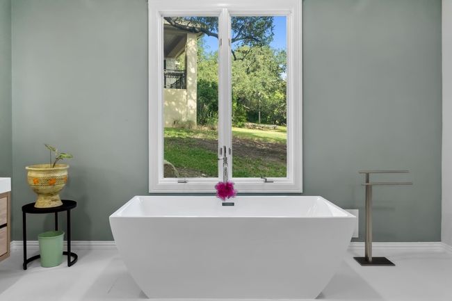Plenty of natural light, plus privacy windows, in the lower-level primary bathroom. | Image 20