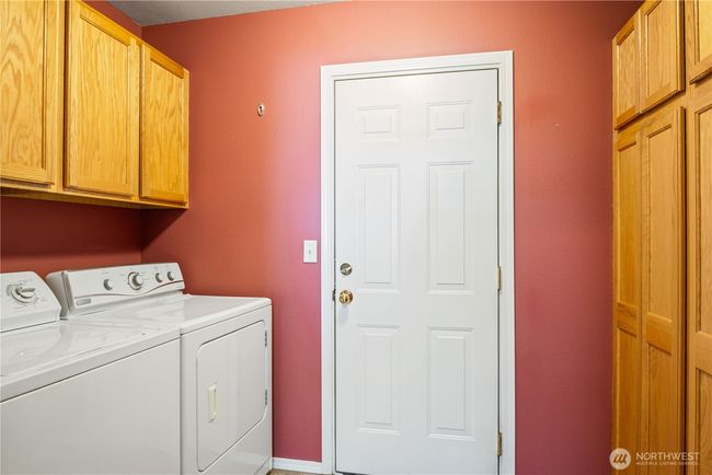 Utility room with tons of storage | Image 12