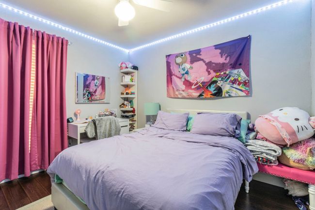 Bedroom featuring dark wood-style floors and a ceiling fan | Image 16
