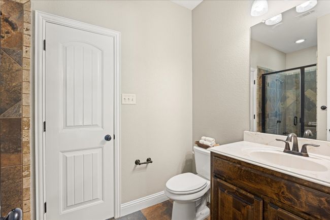 Full bathroom with a shower stall and vanity | Image 10