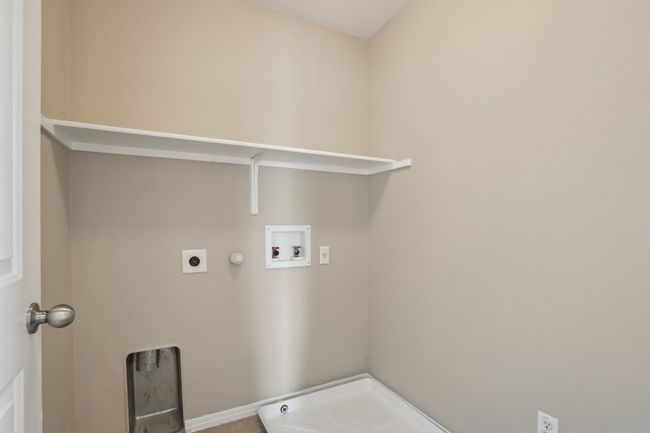 Laundry room with hookup for an electric dryer, washer hookup, hookup for a gas dryer, baseboards, and laundry area | Image 24