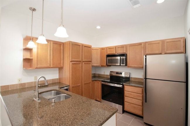 Another view of the open and Updated Kitchen. | Image 19