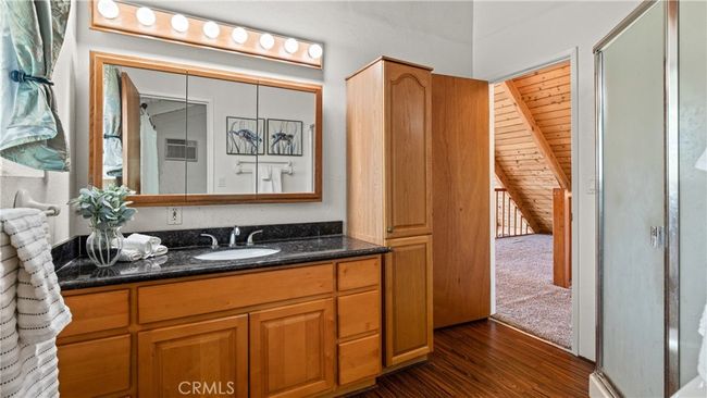 Bathroom adjacent to loft and primary bedroom upstairs - ample closet space and a corner step-in shower & new toilet. | Image 16