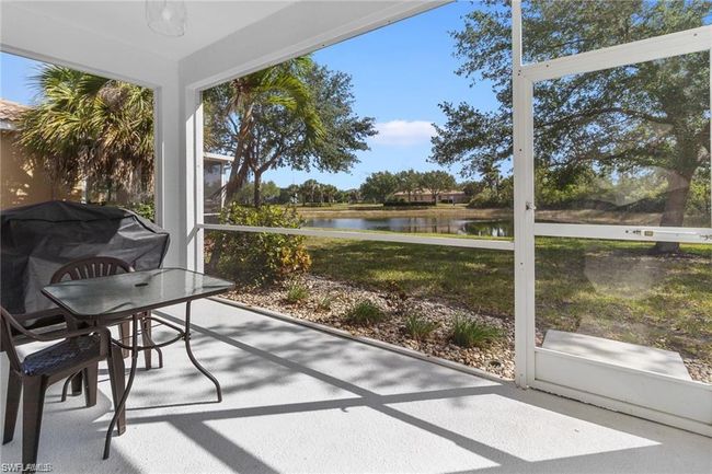 Sunroom / solarium featuring a water view | Image 10