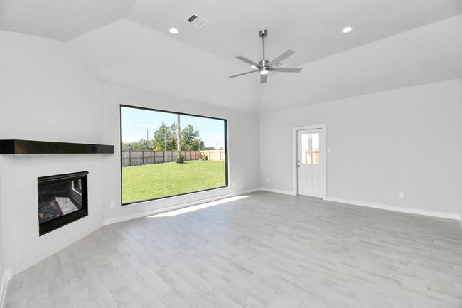 Take another glimpse into the heart of the home with this additional view of the family room—a sprawling space ready to accommodate all your gatherings. | Image 22