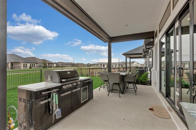Outdoor kitchen on coverd patio in back yard | Image 19