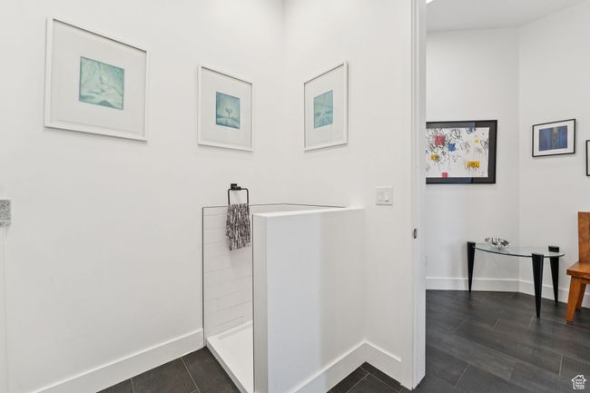 Bathroom with a shower and tile patterned flooring | Image 39