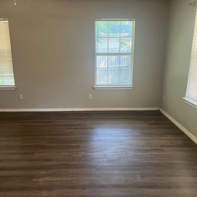 Unfurnished room with dark wood-type flooring and baseboards | Image 6
