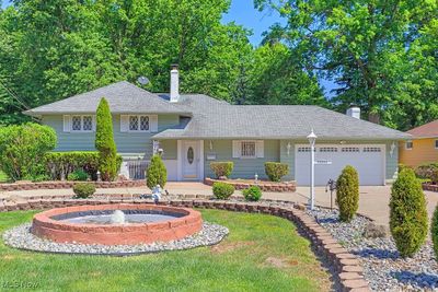 View of Front of Property With Circular Driveway, Pond and 2 Car Attached Garage | Image 2