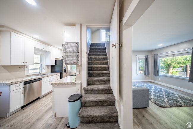 Stairs featuring wood finished floors and recessed lighting | Image 11