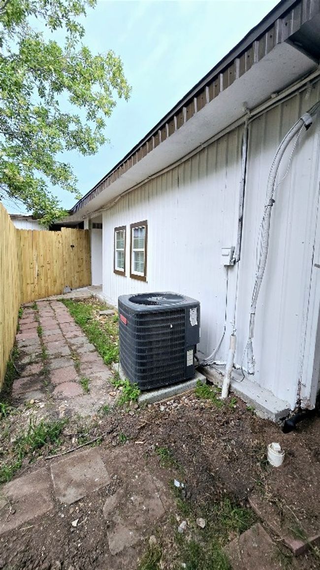 View of home's exterior featuring fence and cooling unit | Image 33