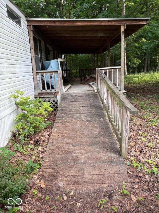wooden deck with driveway | Image 4