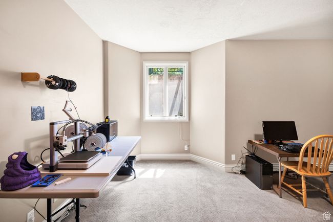 Carpeted office space with baseboards | Image 67