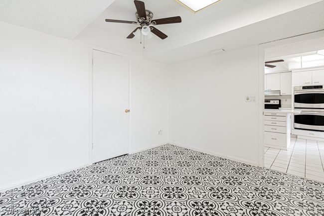 Empty room featuring light tile flooring and ceiling fan | Image 27