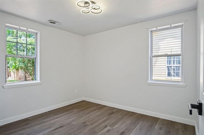 Unfurnished room featuring dark wood-style floors | Image 8