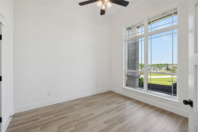Unfurnished room with crown molding and light hardwood / wood-style floors | Image 5