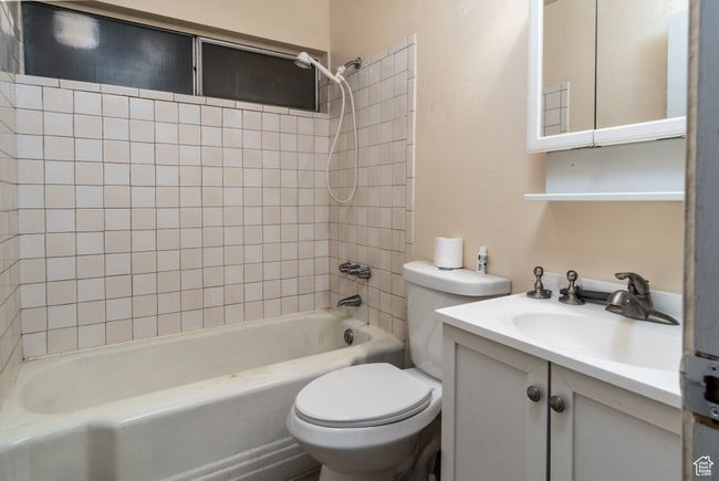 Bathroom featuring shower / washtub combination and vanity | Image 21