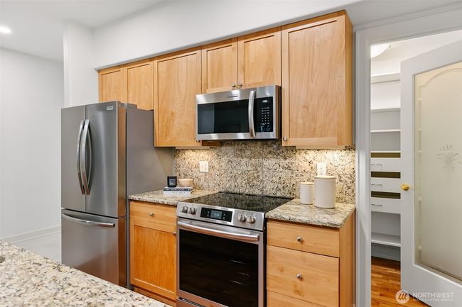 Kitchen with all new stainless steel appliances. Huge pantry to the right. | Image 5