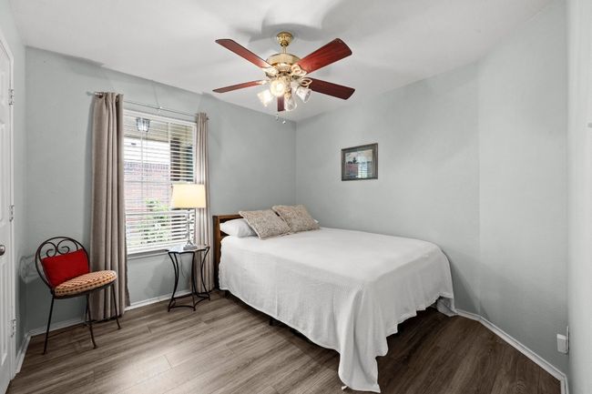 Bedroom with LVP floors, and a ceiling fan | Image 18