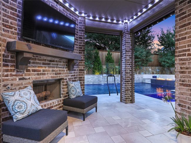 Outdoor gas starter wood burning fireplace and TV | Image 8