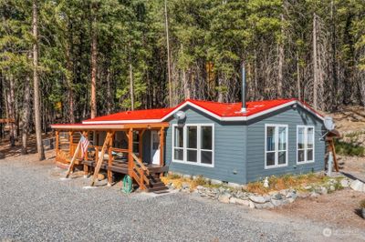 Home is fire wise with concrete siding and metal roof. All porches and decks are self-supported. | Image 2