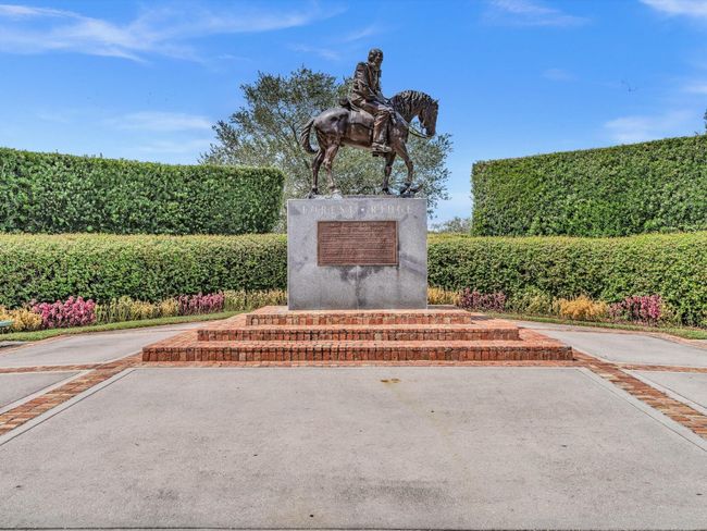 Statue at main entrance. Walking/Biking Trail starts behind the status which leads to Tree Tops! | Image 41