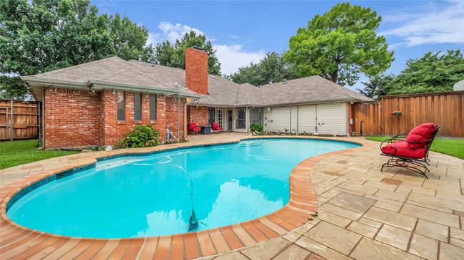 View of pool featuring a patio area and a fenced backyard | Image 24