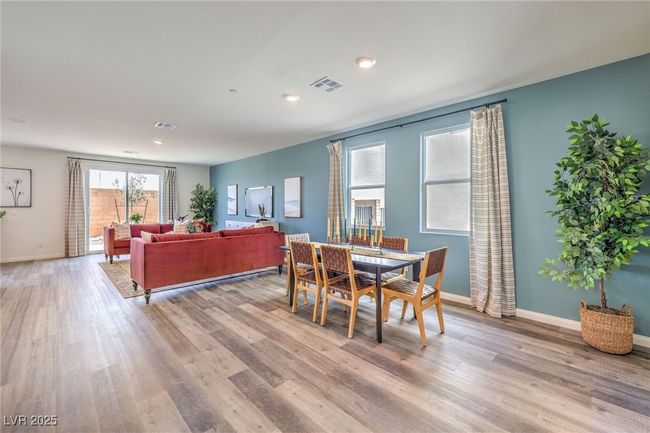 Dining area with light wood-style flooring, baseboards, and recessed lighting | Image 8