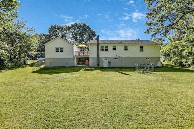 Back of property with a yard and a deck | Image 13