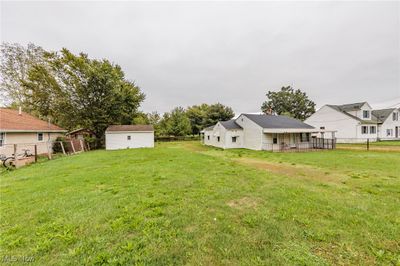 View of yard with a storage unit | Image 2