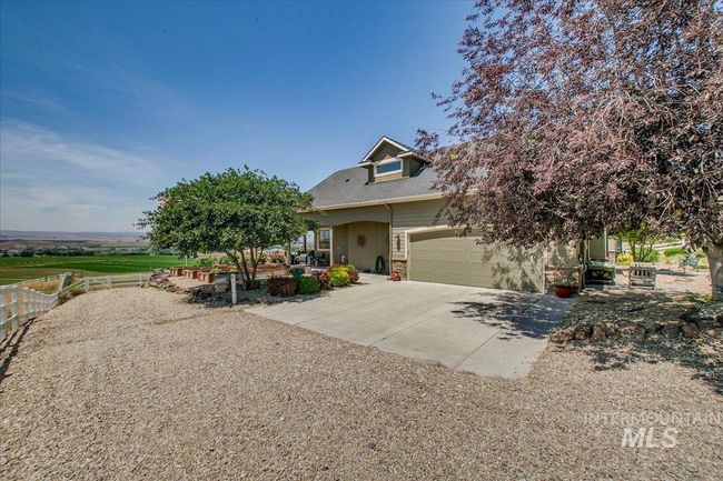 View of property hidden behind natural elements with driveway | Image 35