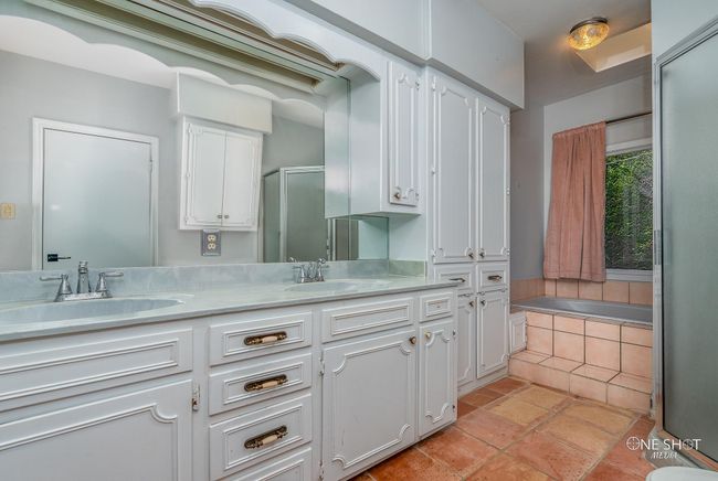 Bathroom featuring vanity and plus walk in shower | Image 23