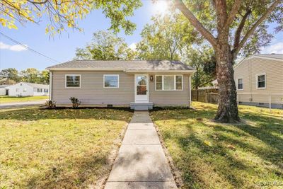 Bungalow-style home with a front lawn | Image 1