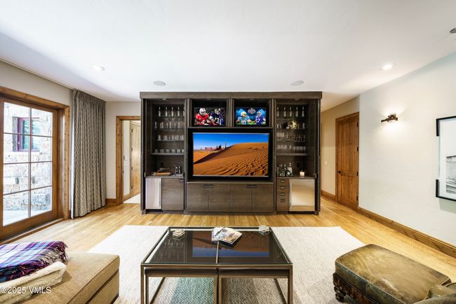Lower Level Family Room with one 80” TV and two 32” TVs. | Image 35