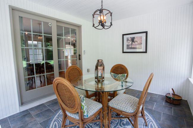 Beautiful sunroom with screens and storm shutters. | Image 17