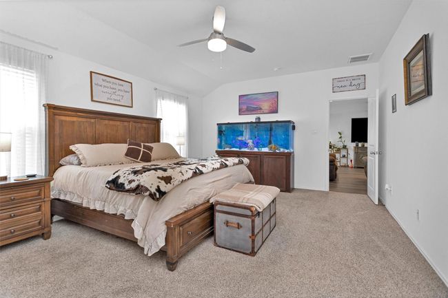 This primary bedroom is tucked in the rear of the home. | Image 18
