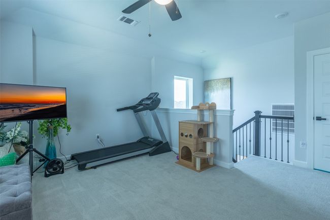 Exercise room featuring carpet floors and a ceiling fan | Image 30