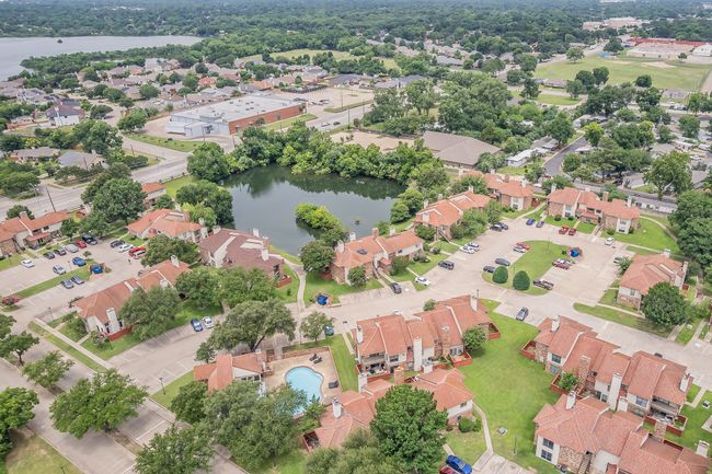 Aerial perspective of suburban area with a large body of water | Image 30