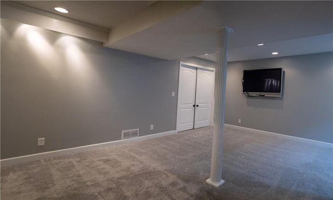 Spare room featuring carpet floors and baseboards | Image 18