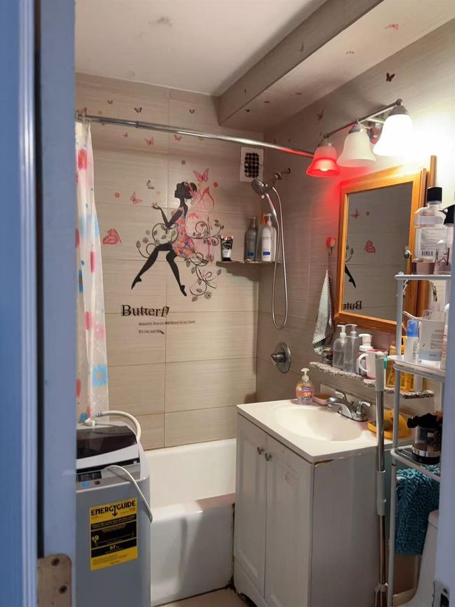 Bathroom with vanity and shower / bathtub combination with curtain | Image 8