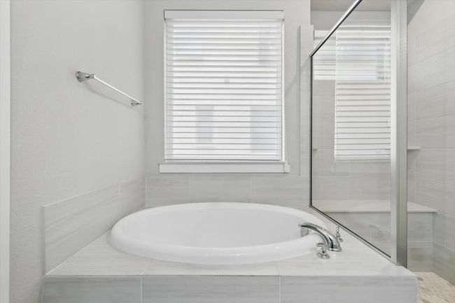 Full bathroom with a garden tub | Image 15