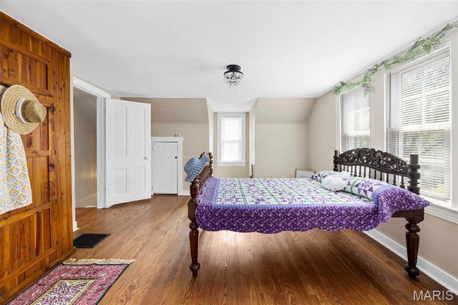 Bedroom featuring wood finished floors and baseboards | Image 20