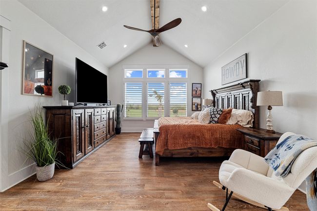 Bedroom featuring visible vents, light wood-style flooring, baseboards, ceiling fan, and recessed lighting | Image 9