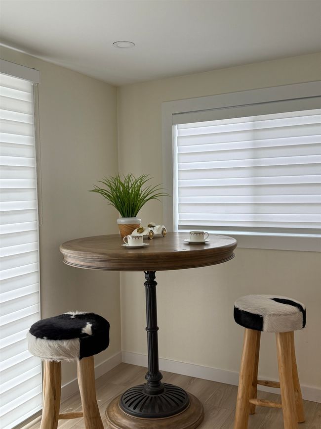 Dining area with light wood finished floors and baseboards | Image 15