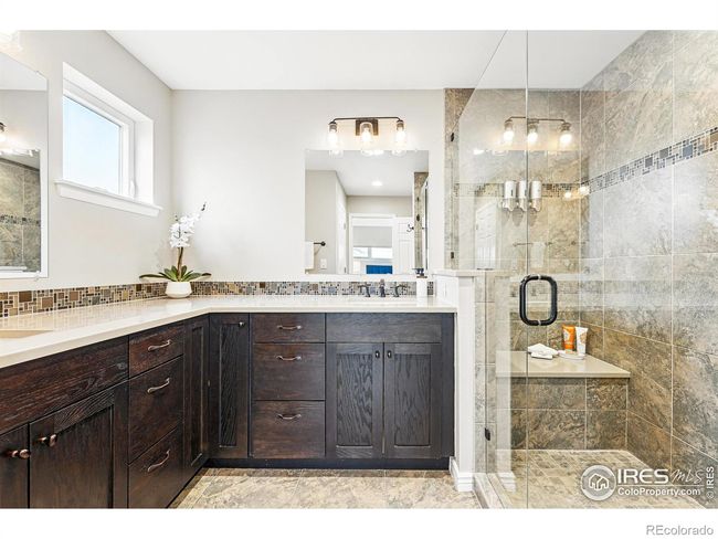 double sinks and a spacious shower in the primary bathroom | Image 18