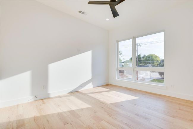 Unfurnished room featuring ceiling fan and light wood-type flooring | Image 32